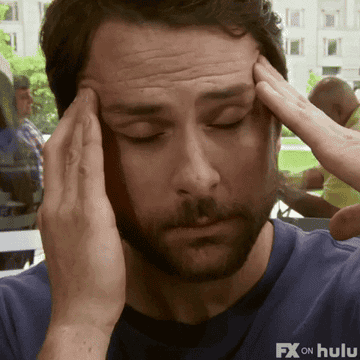 Charlie Day in "It's Always Sunny in Philadelphia" rubbing his temples