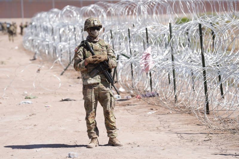 Members of the Operation Lone Star work to block migrants from illegally entering Texas in 2023 near El Paso. Sen. J.D. Vance, R-Ohio, introduced a bill Thursday that would block the federal government from removing fencing along the southern border.

File Photo by Mark Otte/Texas Army National Guard/UPI