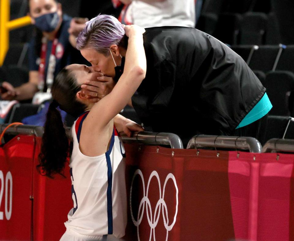 Sue Bird #6 of Team United States kisses Megan Rapinoe in celebration after the United States' win over Japan in the Women's Basketball final game on day sixteen of the 2020 Tokyo Olympic games at Saitama Super Arena on August 08, 2021 in Saitama, Japan