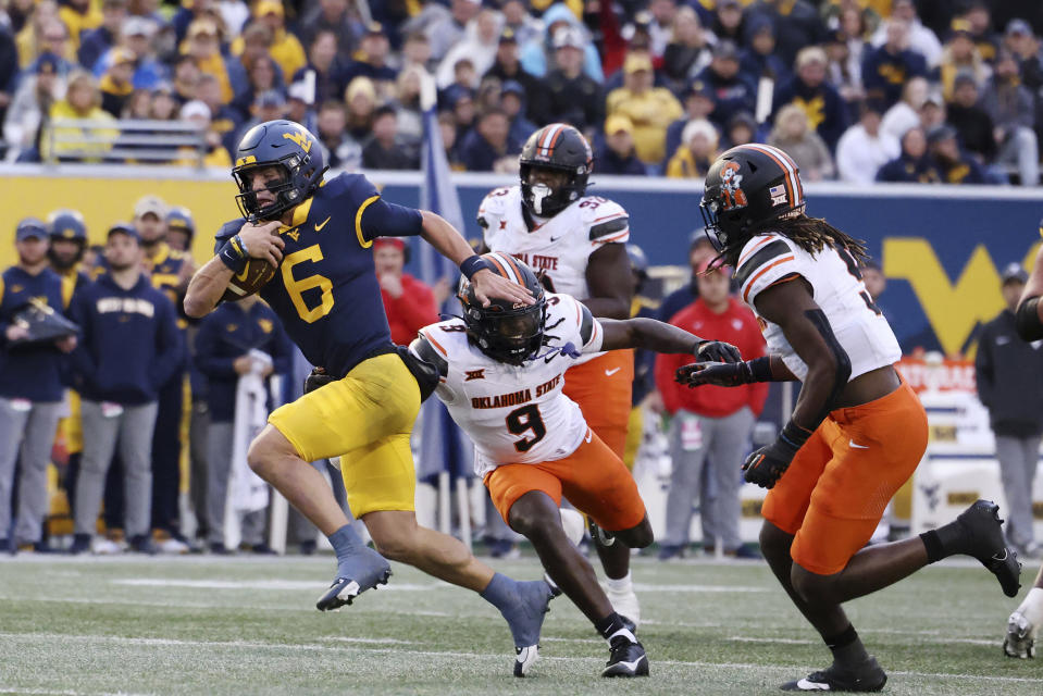 West Virginia quarterback Garrett Greene (6) carries the ball on a quarterback keeper during the second half of an NCAA college football game against Oklahoma State, Saturday, Oct. 21, 2023, in Morgantown, W.Va. (AP Photo/Chris Jackson)