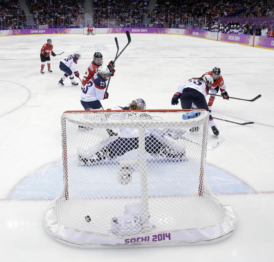 Marie-Philip Poulin of Canada (29) scores the game-winning goal against USA in overtime during the women's gold medal ice hockey game at the 2014 Winter Olympics, Thursday, Feb. 20, 2014, in Sochi, Russia. (AP Photo/David J. Phillip )