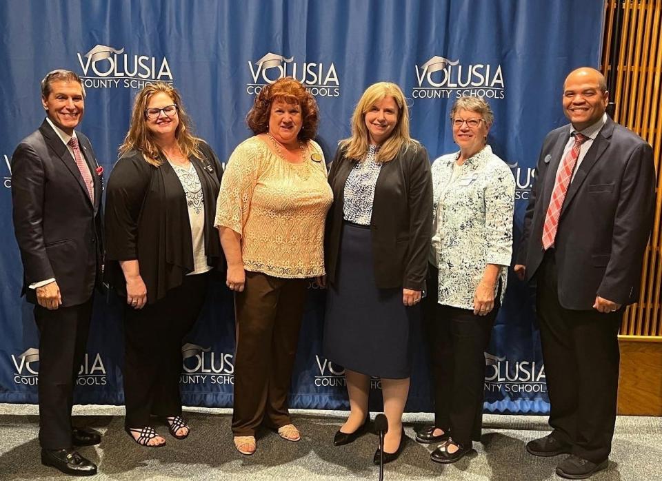 Volusia County School Board members pose with Rachel Hazel, third from right, who has been serving as interim superintendent and was named deputy superintendent of teaching, leading and learning at Tuesday's meeting. The board members are, from left, Carl Persis, Anita Burnette, Jamie Haynes, Linda Cuthbert and Chair Ruben Colon.