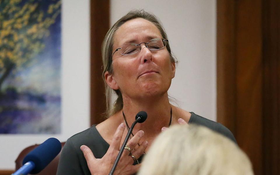 Scarlett Lewis, the mother of Jesse, 6, who was killed in the shooting, testifies in court - REUTERS