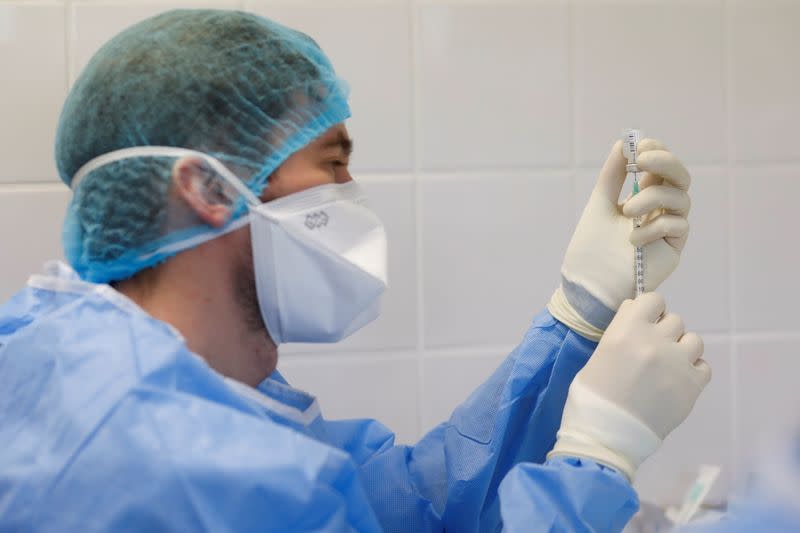 A medical worker prepares the Pfizer-BioNTech COVID-19 vaccine at Sao Jose Hospital in Lisbon