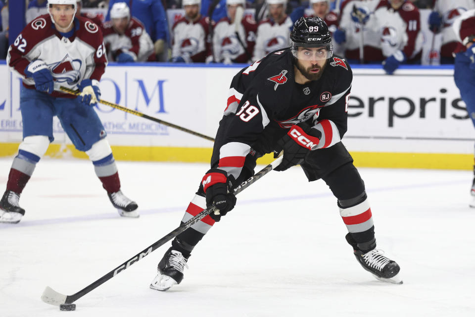 Buffalo Sabres right wing Alex Tuch (89) carries the puck past Colorado Avalanche left wing Artturi Lehkonen (62)during the first period of an NHL hockey game Sunday, Oct. 29, 2023, in Buffalo, N.Y. (AP Photo/Jeffrey T. Barnes)