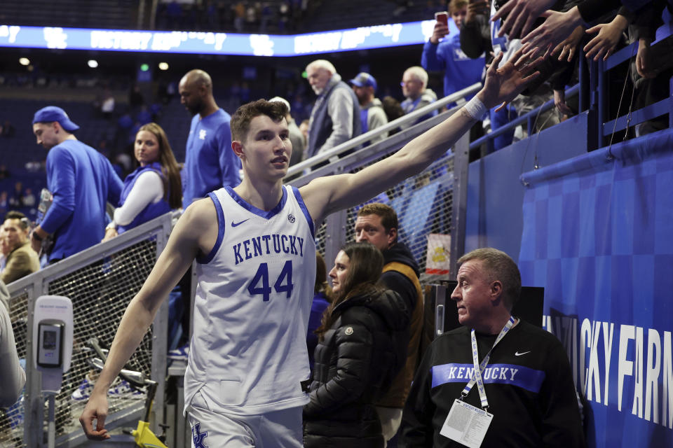 Kentucky's Zvonimir Ivisic (44) greets fans after the team's NCAA college basketball game against Georgia on Saturday, Jan. 20, 2024, in Lexington, Ky. Kentucky won 105-96. (AP Photo/James Crisp)