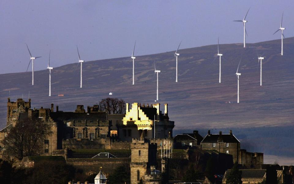 Wind turbines line the hillside in Stirling, Scotland (Jeff J Mitchell/Getty)