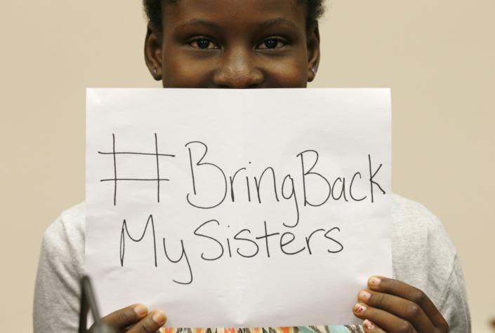 CLICK for slideshow: Nigerian teenager Deborah Peters, the sole survivor of a Boko Haram attack on her family in 2011, holds up a sign referring to the kidnapped Chibok secondary schoolgirls, while speaking to reporters on Capitol Hill in Washington May 21, 2014. Peters was on Capitol Hill to attend a hearing by the House Foreign Affairs Committee on Boko Haram: The Growing Threat to Schoolgirls, Nigeria, and Beyond. Deborah says she knows at least one of the kidnapped girls. (REUTERS/Kevin Lamarque) 