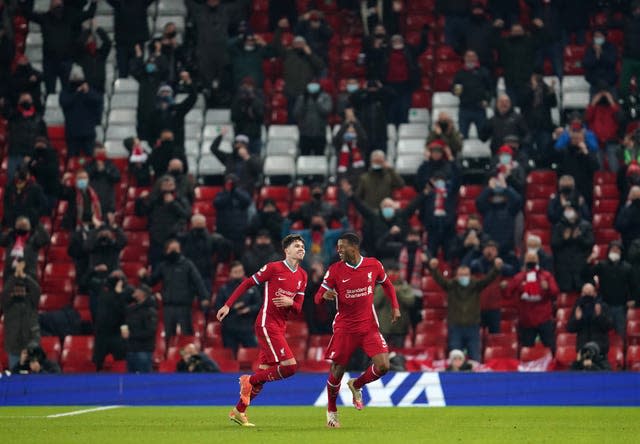 Georginio Wijnaldum, right, celebrates scoring Liverpool's second goal in a 4-0 win over Wolves on December 6. The game was notable for the return of fans, with 2,000 Reds supporters at Anfield to watch their club for the first time as Premier League champions. Games soon returned to being played behind closed doors after England entered another lockdown following Christmas