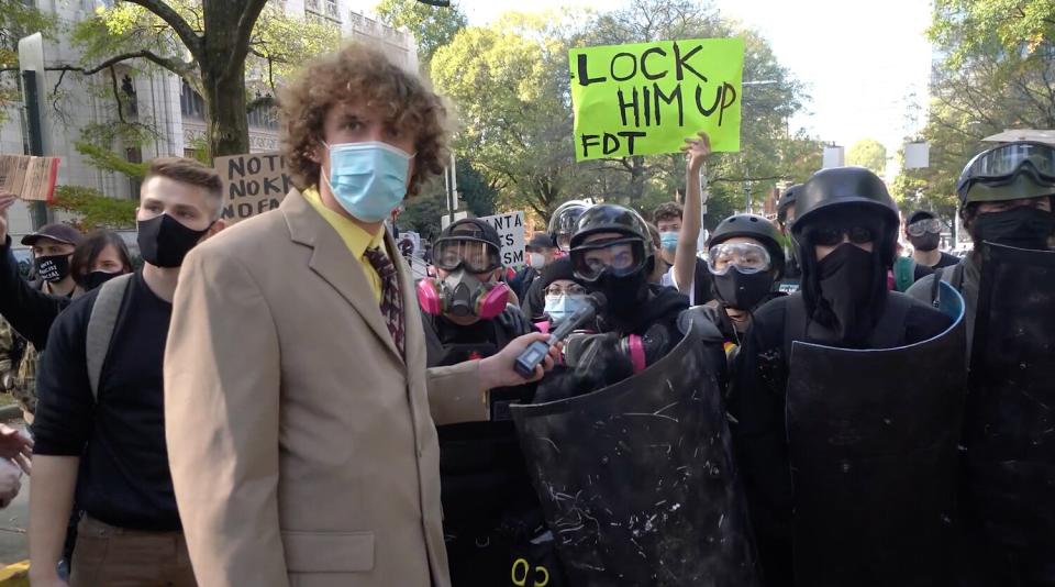 Andrew Callaghan and protesters in black bloc, HBO, This Place Rules