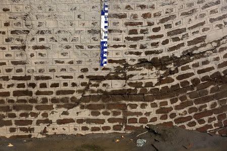 A measuring gauge is pictured in the partially damaged Munak canal, that supplies three-fifths of the water to Delhi, in Sonipat in Haryana, India, February 24, 2016. REUTERS/Cathal McNaughton