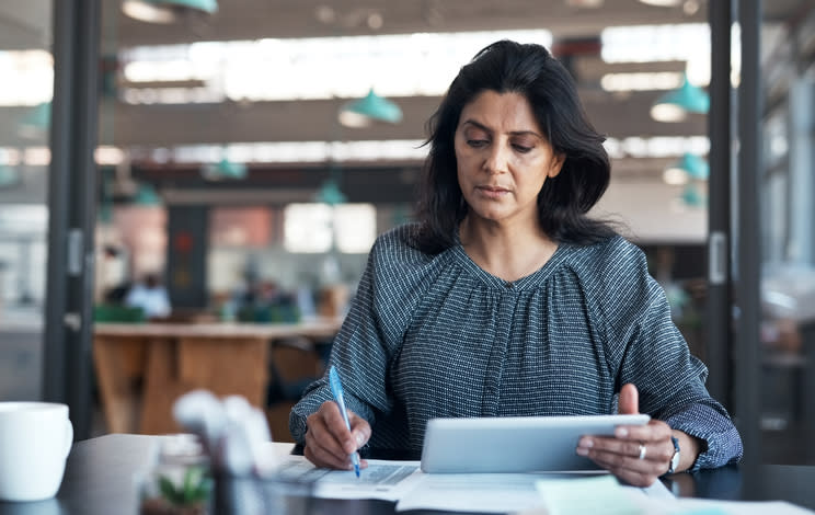 A woman calculating her average net worth.