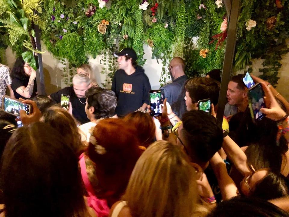 David Dobrik behind a DJ booth at a Chicago nightclub.