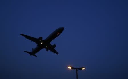 An aeroplane prepares to land at an airport in New Delhi