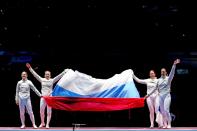 <p>Russia celebrates winning gold after the Women’s Sabre Team gold medal match between Russia and Ukraine on Day 8 of the Rio 2016 Olympic Games at Carioca Arena 3 on August 13, 2016 in Rio de Janeiro, Brazil. (Photo by Tom Pennington/Getty Images) </p>