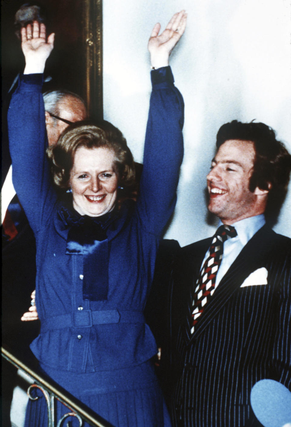 FILE - Britain's Margaret Thatcher waves in celebration at Conservative Party headquarters in London in the early hours of May 4, 1979, after winning the General Election. At right is her son Mark. Britain’s upcoming general election on July 4, 2024, is widely expected to lead to a change of government for the first time in 14 years. Britain's general election in 1979 is without doubt the most consequential since 1945, with Margaret Thatcher becoming the country’s first female prime minister on a radical Conservative economic agenda. At its heart, Thatcherism represented a total rethink over the role of the state. (AP Photo/Bob Dear, File)