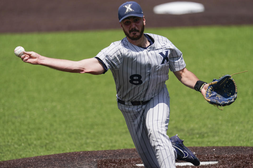 Xavier pitcher Jonathan Kelly (8) pitches against Oregon during the eighth inning of an NCAA college baseball tournament regional game Friday, June 2, 2023, in Nashville, Tenn. (AP Photo/George Walker IV)