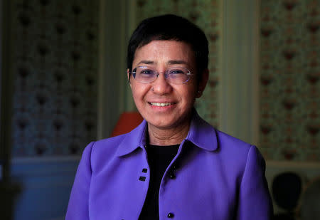 FILE PHOTO: Maria Ressa, journalist and CEO of the Rappler news website, poses before a news conference to launch a commission to draft an "International Declaration on Information and Democracy" hold by Human rights group Reporters Without Borders in Paris, France, September 11, 2018. REUTERS/Gonzalo Fuentes/File Photo