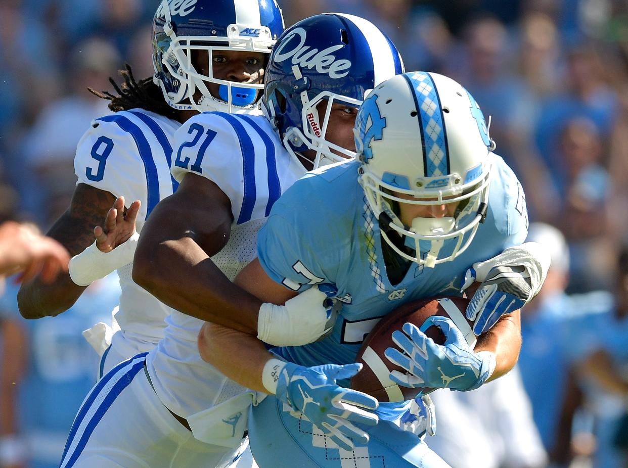 CHAPEL HILL, NC – SEPTEMBER 23: Alonzo Saxton II #21 of the Duke Blue Devils tackles Austin Proehl #7 of the North Carolina Tar Heels during their game at Kenan Stadium on September 23, 2017 in Chapel Hill, North Carolina. (Photo by Grant Halverson/Getty Images)