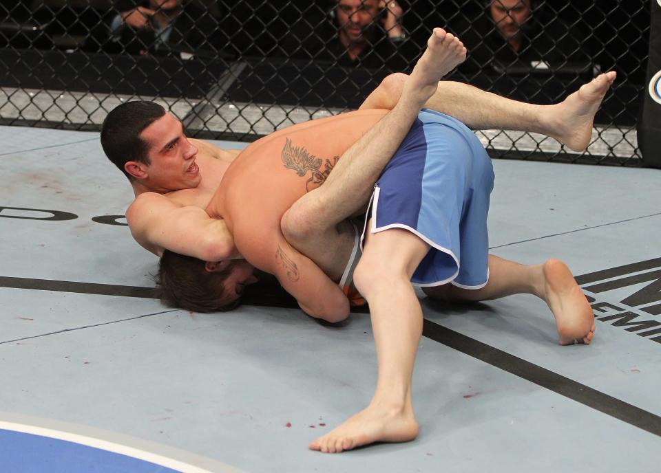 Roland Delorme attempts to submit Josh Ferguson with a guillotine choke during The Ultimate Fighter 14 Finale at the Pearl Theatre at the Palms Hotel and Casino on December 3, 2011 in Las Vegas, Nevada. (Photo by Josh Hedges/Zuffa LLC/Zuffa LLC via Getty Images)