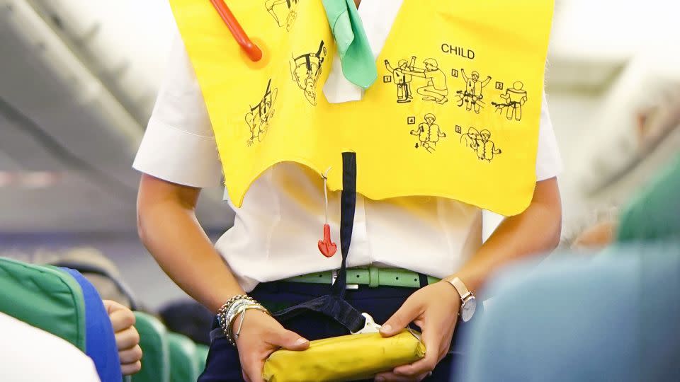 Flight attendants want passengers to pay attention during safety briefings. - Igor Vershinsky/iStockphoto/Getty Images