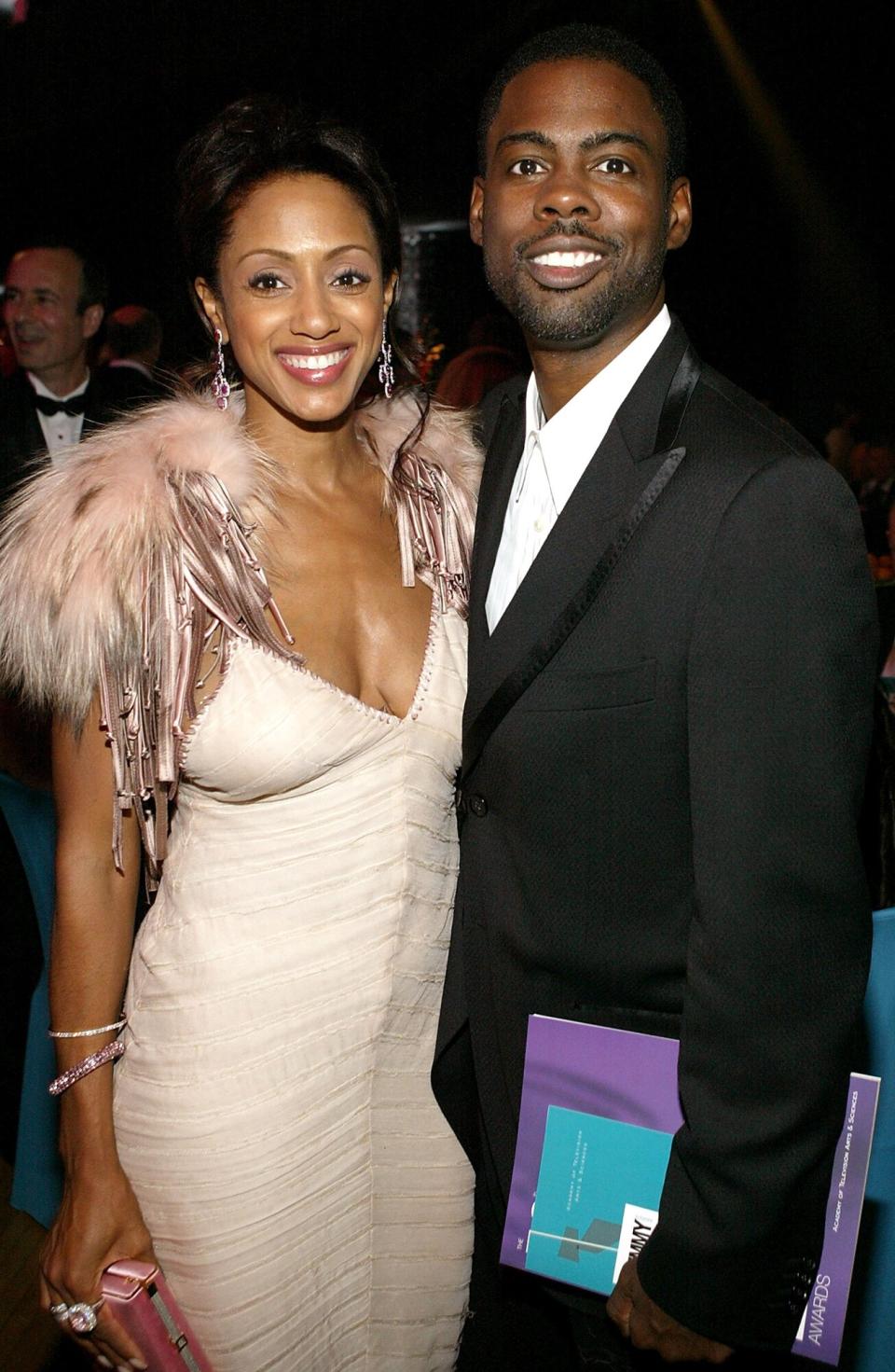 Chris Rock (R) and his wife Malaak Compton-Rock mingle at the Governor's Ball after the 56th Annual Primetime Emmy Awards at the Shrine Auditorium September 19, 2004 in Los Angeles, California