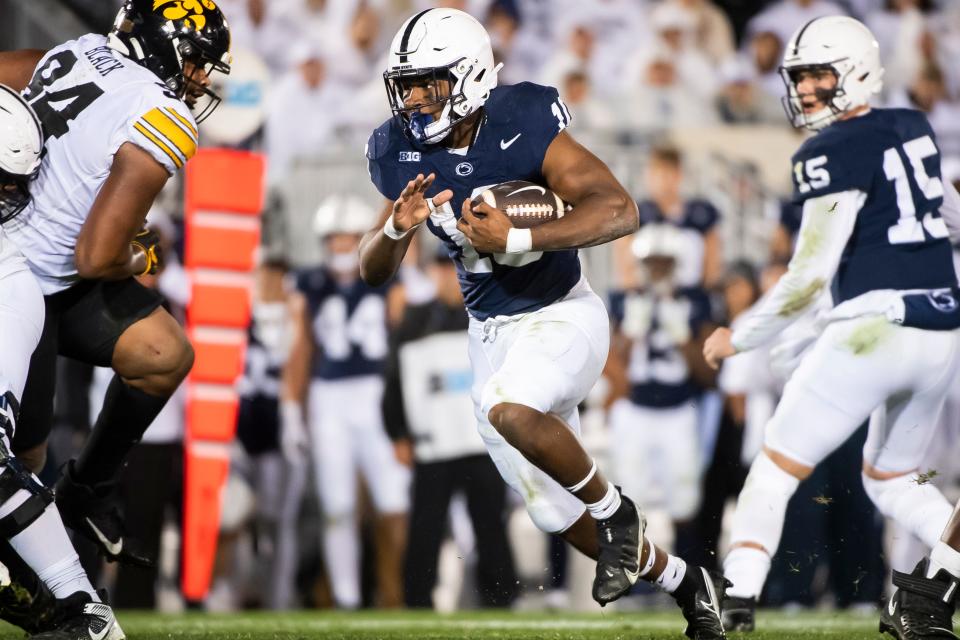 Penn State running back Nick Singleton carries the ball during the first half of a White Out game against Iowa Saturday, Sept. 23, 2023, in State College, Pa.