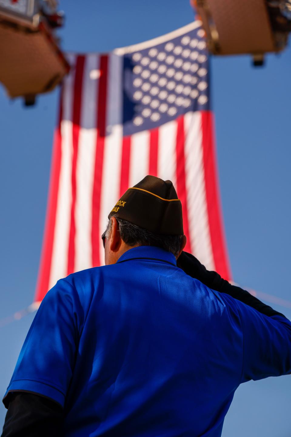 Members of the Lubbock VFW salute the United States flag during the Veterans Day Parade on Saturday, Nov. 6, 2021 through Lubbock.