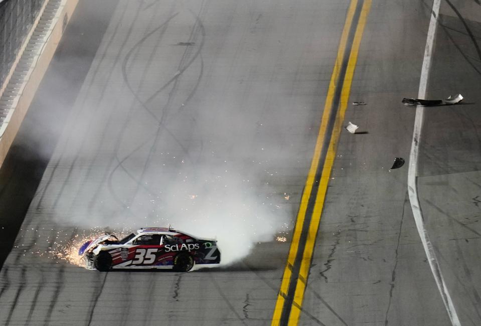 CJ McLaughlin makes hard contact with the wall and showers debris during the final stage of the Beef. It's What's for Dinner 300. at Daytona International Speeday on Saturday night.
