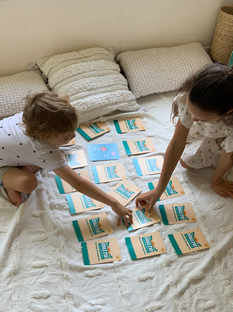 A young boy and girl playing the Mizzie The Kangaroo memory card game