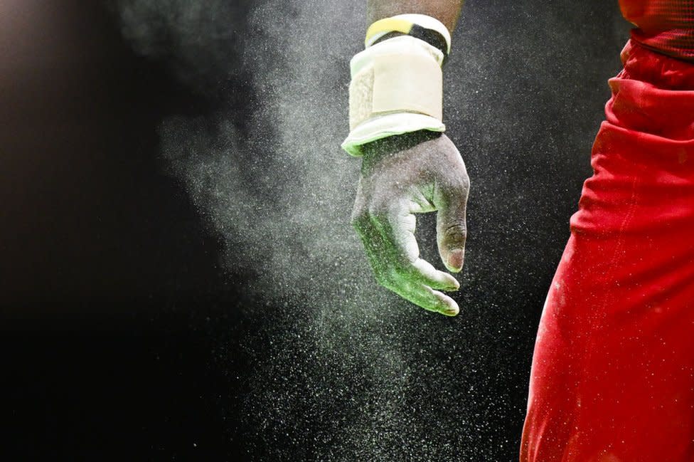 The hands of Belgium's Noah Kuavita is seen before competing on the pommel horse during the Men's All-Around Finals plus qualification for Team and Individual Apparatus Finals event at the Artistic Gymnastics European Championships, in Rimini, Italy, April 24, 2024.