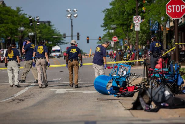 PHOTO: In this July 5, 2022, file photo, FBI agents work the scene of a shooting at a Fourth of July parade in Highland Park, Illinois. (Jim Vondruska/Getty Images, FILE)