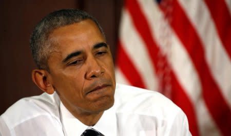 U.S. President Barack Obama pauses while hosting a conversation on community policing and criminal justice at the White House in Washington July 13, 2016. REUTERS/Kevin Lamarque