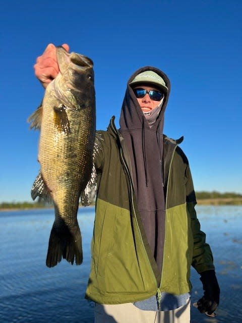 Joe Hingson holds a fine shad spawn bass, caught while fishing with Capt Paul Tyre on Lake Seminole this past week.