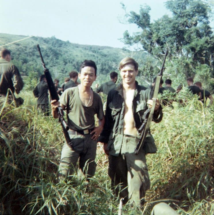 This 1969 photo provided by James McCloughan shows the former Army medic, right, with a platoon interpreter in Nui Yon Hill in Vietnam. McCloughan — who saved the lives of 10 soldiers during the Battle of Nui Yon Hill in May 1969 in Vietnam — will become the first person to be awarded the nation's highest military honor by President Trump. (Courtesy of James McCloughan via AP)