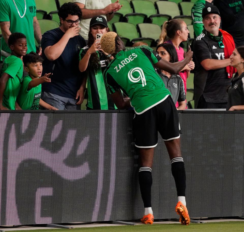 Austin FC forward Gyasi Zardes celebrates with fans after scoring a goal Saturday night at Q2 Stadium. It was his second straight match with a goal and also the second straight win for El Tree, which dispatched Toronto FC 1-0.