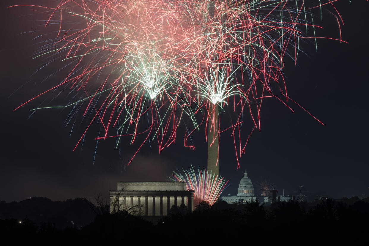 Fireworks above the Lincoln Memorial, the Washington Monument and the U.S. Capitol building.