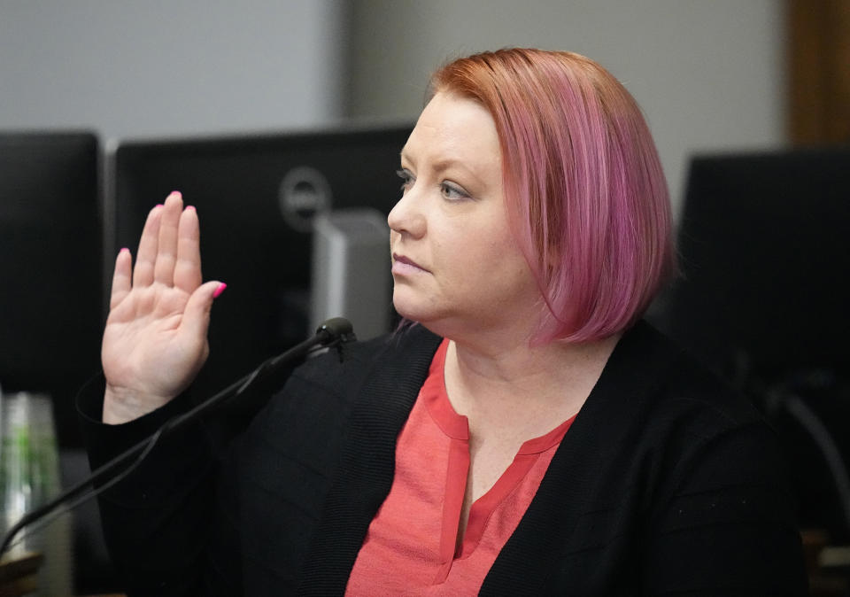 Hilary Rudy, deputy director, elections division, Colorado Department of State, is sworn in to testify during a hearing for a lawsuit to keep former President Donald Trump off the state ballot in court Wednesday, Nov. 1, 2023, in Denver. (AP Photo/Jack Dempsey, Pool)