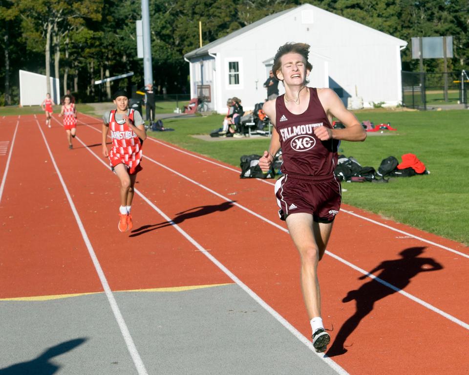 Milo Van Mooy of Falmouth heads for the finish ahead of Bavriel Pichardo of Barnstable in a cross country meet.