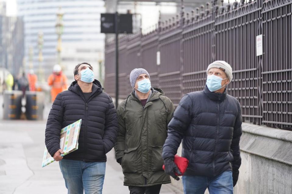 Face masks were again made mandatory in shops and public transport in England following the emergence of the Omicron variant (PA) (PA Wire)