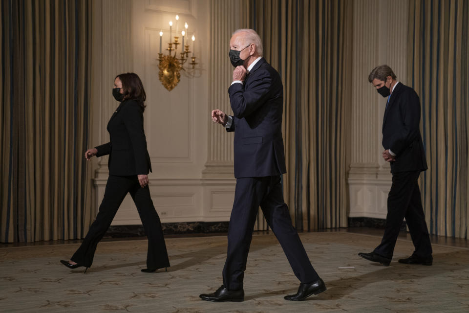 Vice President Kamala Harris, left, President Joe Biden, center, and Special Presidential Envoy for Climate John Kerry walk off after an event on climate change and green jobs, in the State Dining Room of the White House, Wednesday, Jan. 27, 2021, in Washington. (AP Photo/Evan Vucci)