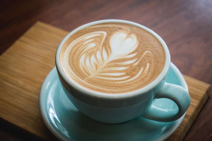 Close-Up Of Coffee Cup On Table with foam art