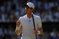 Great Britain's Andy Murray celebrates a point against Serbia's Novak Djokovic on day thirteen of the Wimbledon Championships at The All England Lawn Tennis and Croquet Club, Wimbledon.