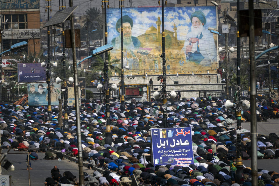 Worshippers gather for Friday prayers in the Sadr City neighborhood of Baghdad, on Friday, March 3, 2023. This working-class, conservative and largely Shiite suburb in eastern Baghdad is home to more than 1.5 million people. (AP Photo/Jerome Delay)