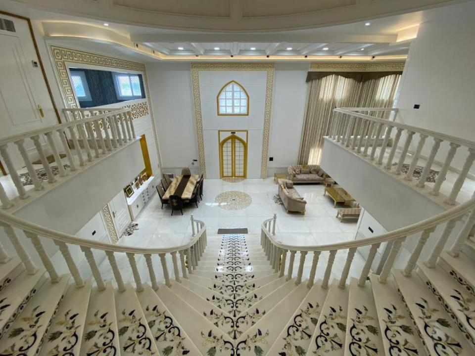 This undated photograph provided by Indian businessman Anand Prakash Chouksey shows the interior of a house resembling India’s iconic Taj Mahal monument built by Chouksey as a residence for him and his wife to live in at Burhanpur, Madhya Pradesh, India. Constructed with white marble procured from Makrana, a city in Rajasthan state and the same place that gave the Taj Mahal its marble, the smaller imitation embodies several aspects of the real monument, including the large dome, intricate minarets and even artwork seen on the original. ( Anand Prakash Chouksey via AP)