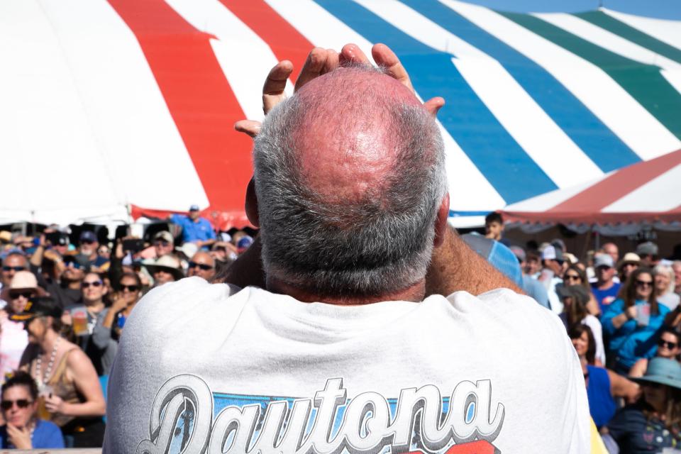 Charlie Montgomery shoves raw oysters in his mouth during the Men's Oyster Eating Contest at the 44th annual Fulton Oysterfest Saturday, March 4, 2023.