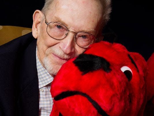 Author and cartoonist Norman Bridwell, creator of Clifford the Big Red Dog, poses for a portrait at Scholastic headquarters in New York, May 4, 2011.