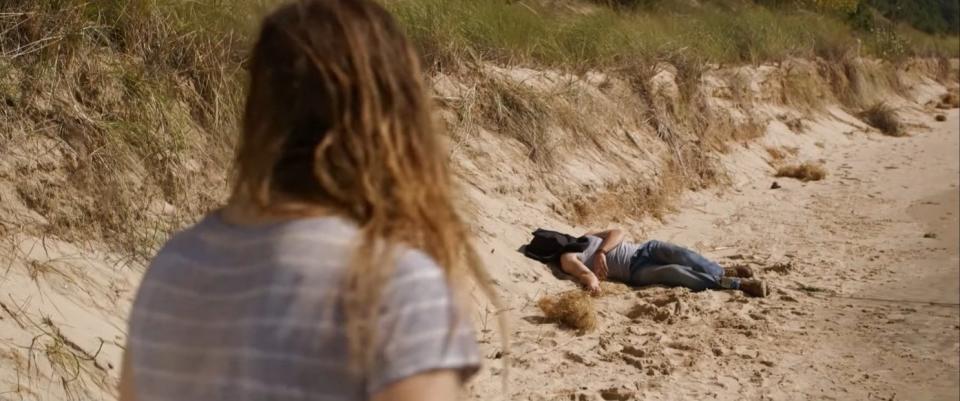 A woman discovered a hooded and chained body on a beach in "Ruin Me"