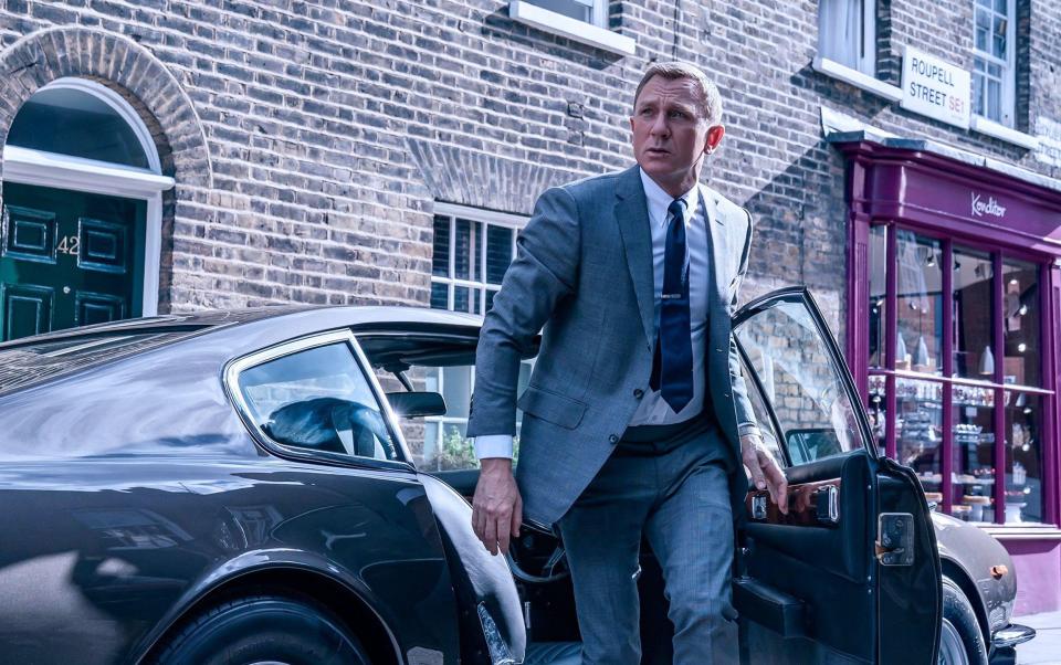 Suits you: Hemming dressed every Bond from GoldenEye to Casino Royale