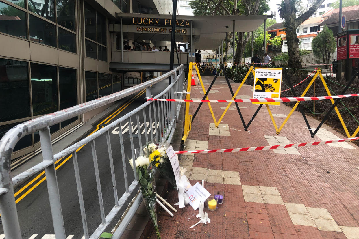 Flowers and cards seen at Lucky Plaza on Monday (30 December), a day after a fatal accident in which a car struck six Filipina domestic workers. (PHOTO: Dhany Osman / Yahoo News Singapore)